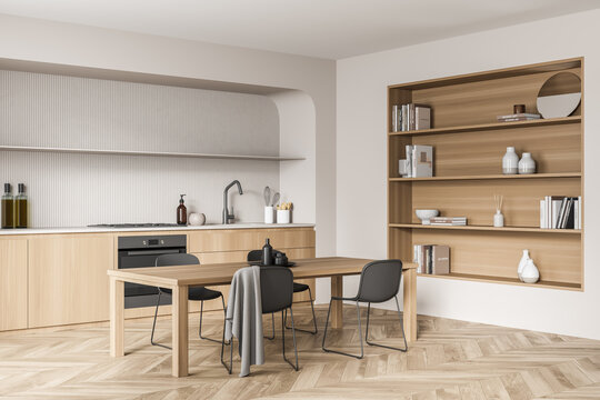 Corner view of beige wood kitchen with niche shelves