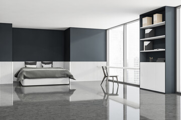 Corner view of blue and grey bedroom with home office