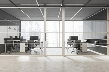 Framed glass door of stylish grey panoramic office