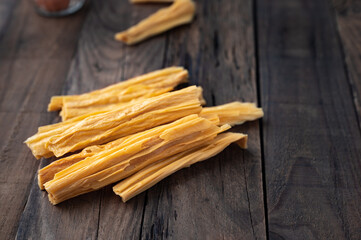 Dried bean curd or dry tofu on wood