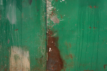 Old rusted green wall. Grunge background        