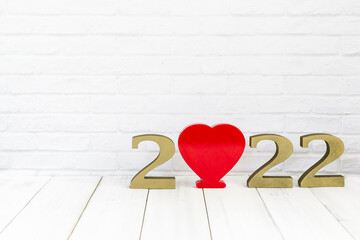 2022 new year and heart  on white wood table over white background with copy space , love concept