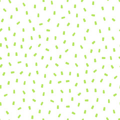 Seamless pattern with green sprinkles and white background