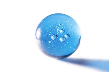 blue glass ball with bubbles against white background