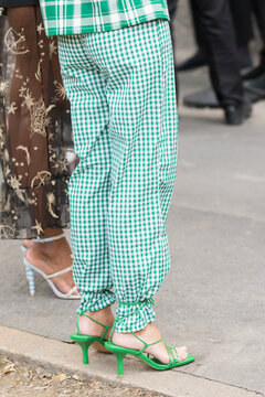September 21, 2021: Model wears green and white checkered pants and green heeled sandals