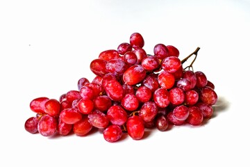 Sweet ripe red grapes isolated on white background