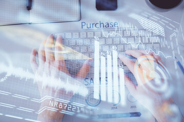 Double exposure of man's hands typing over computer keyboard and tech theme hologram drawing. Top view. Technology concept.