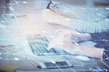 Multi exposure of woman hands working on computer and data theme hologram drawing. Tech concept.