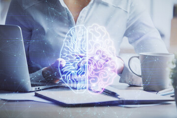 Double exposure of brain sketch hologram and woman holding and using a mobile device.