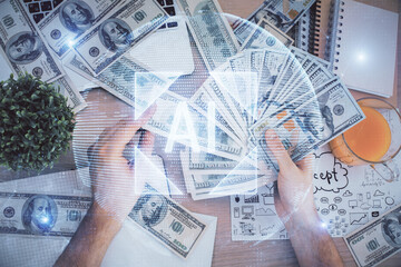 Multi exposure of technology drawing hologram and us dollars bills and man hands. Data concept