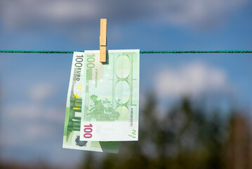 100 and 50 euro banknotes drying. Washed Euro paper bills. Drying euro on a string.Money laundering