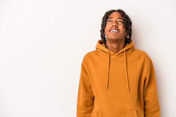 Young african american man isolated on white background shouting very angry, rage concept, frustrated.