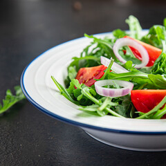 arugula and tomato salad vegetable in a plate fresh meal snack on the table copy space food background rustic veggie vegan or vegetarian food