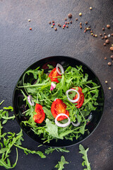 arugula and tomato salad vegetable in a plate fresh meal snack on the table copy space food background rustic veggie vegan or vegetarian food