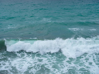 Beautiful view of ocean waves and a fantastic rocky shore, Sea patterns, background wallpaper.