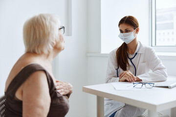Fototapeta premium female doctor patient examination medical specialist