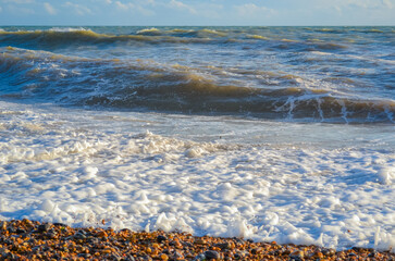 Small storm at sunset, high waves with white foam © Delia_Suvari
