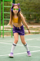 Schoolgirl preteen resting on sports ground