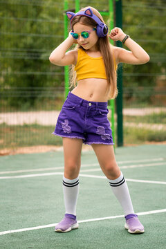 Schoolgirl preteen resting on sports ground