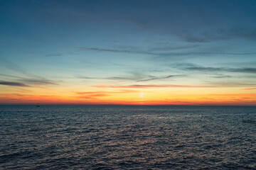 Seascape with a vibrant sunset over a calm sea.