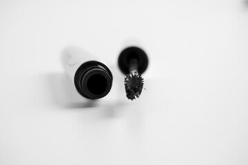 Open mascara, isolated on a white background. Cosmetics for women. A brush for applying mascara. The concept of cosmetics and beauty