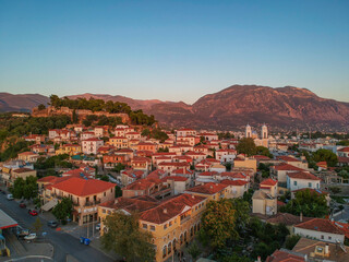 Fototapeta premium Aerial view around the castle hill area and the Metropolitan church of Ypapanti in the old historical town of the seaside Kalamata city, Greece