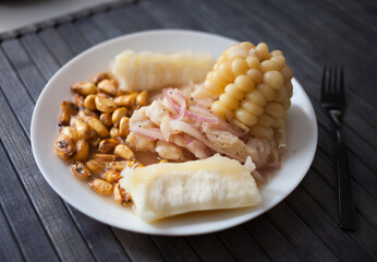 Peruvian traditional dish.fish ceviche with yuka and corn