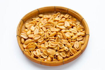 Peanut in bamboo basket on white background.