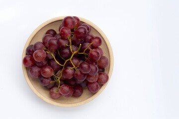 Fresh grape in plate on white background.