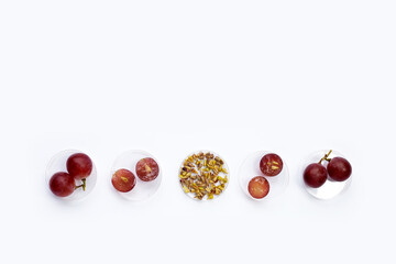 Fresh grape with seeds on white background.