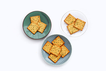 Seaweed crackers in plate on white background.