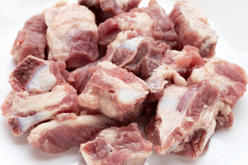Raw pork ribs on white background.