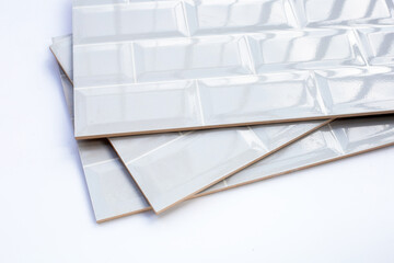 Stack of wall tiles on white background