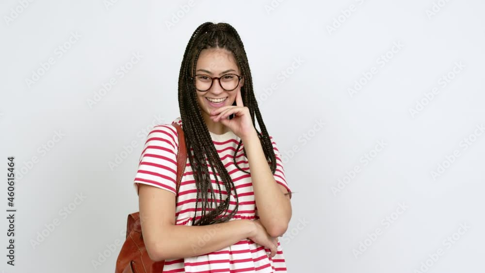 Poster Teenager girl with braids with glasses standing and looking to the side over isolated background