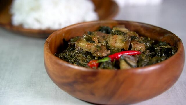 Laing is a Filipino dish of shredded or whole taro leaves with meat or seafood cooked in thick coconut milk spiced with labuyo chili, lemongrass, garlic, shallots, ginger, and shrimp paste