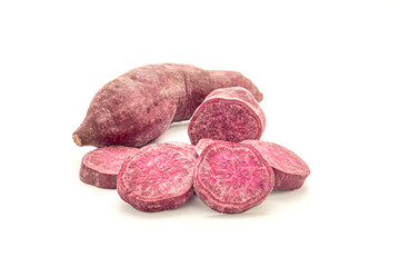 Purple yams or purple sweet potatoes on white background. Side view. Vegan fruit and healthy fruits concept