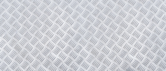 Metal diamond pattern non-skid gray wrap around texture. Panoramic pattern of aluminum floor background and metallic texture