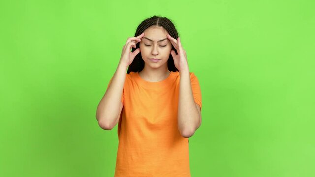Teenager girl with braids unhappy and frustrated with something over isolated background. Green screen chroma key