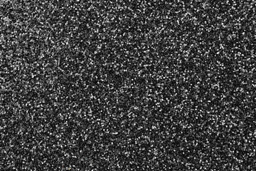 Shining glowing effects concept, black glitter texture background, glitter or sandpapper high detailed surface