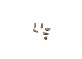 Pile of lead bullet weights with concave bases to fit worm noses isolated on white