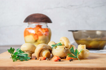 A slide of mushrooms in a close-up on a light background in a gray plate with herbs and peppers...