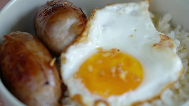 longgasilog, Filipino style hotdog with egg on top of garlic rice is one of favorite dishes of Filipinos 