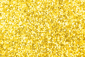 Yellow golden shining glowing effects concept, glitter texture background, sandpapper high detailed surface photo