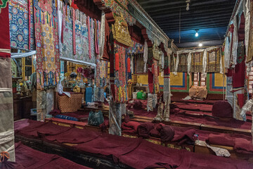 Obraz na płótnie Canvas LHASA, TIBET, CHINA - AUGUST, 17 2018: Interiors of the Ani Sangkhung Nunnery. The Ani Sangkhung Nunnery is one of the oldest active nunneries in Tibet. 