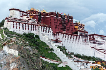 Naklejka premium LHASA, TIBET - AUGUST 17, 2018: Magnificent Potala Palace in Lhasa, home of the Dalai Lama before the Chinese invasion and Unesco World Heritage Site. 