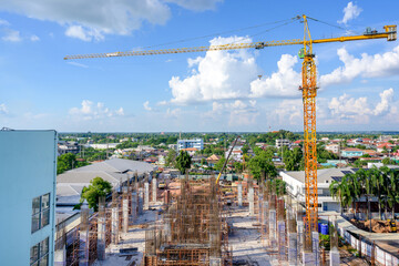 Crane on a large construction site including cranes at construction sites outside buildings a...