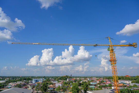 Crane on a large construction site including cranes at construction sites outside buildings a construction site with a blue sky picture from top view