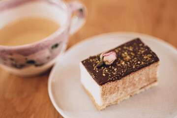 festive cake on a saucer decorated with a rose