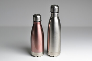 Two stainless thermos water bottle, isolated on white background. Silver color.  Zero waste, no plastic.