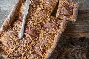 Apple almond cake on rustic wooden table